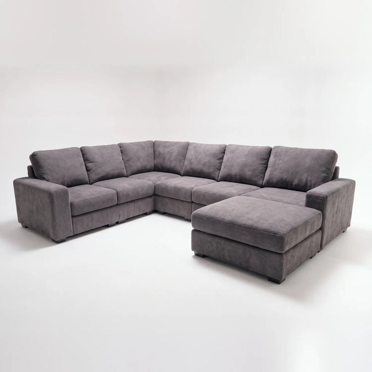 Seven-Piece Chaise Sectional - Cuddle Charcoal Modular - studio photo on white (RHF arrangement) #vera_main