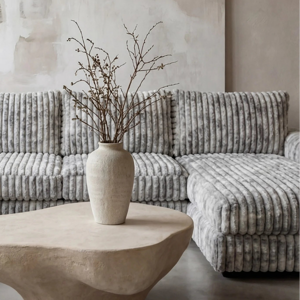 Big Wig Grey two-piece sectional staged in a styled living room