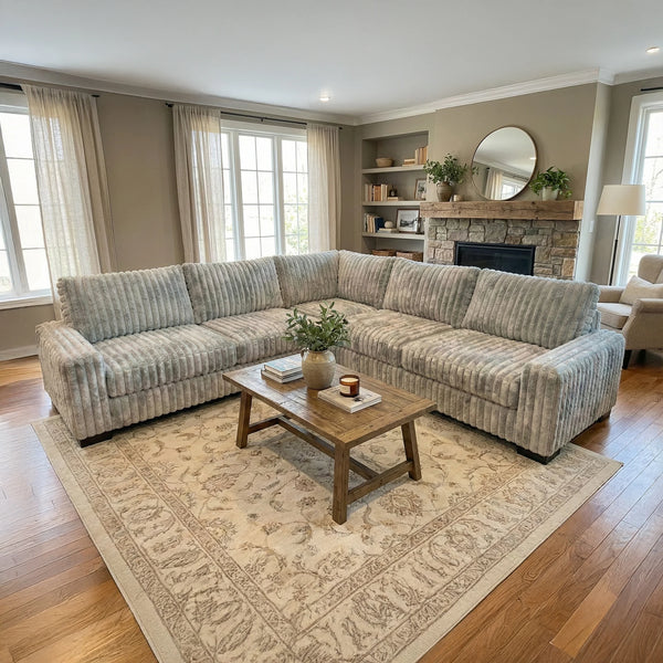 Big Wig Grey three-piece corner sectional staged in a styled living room