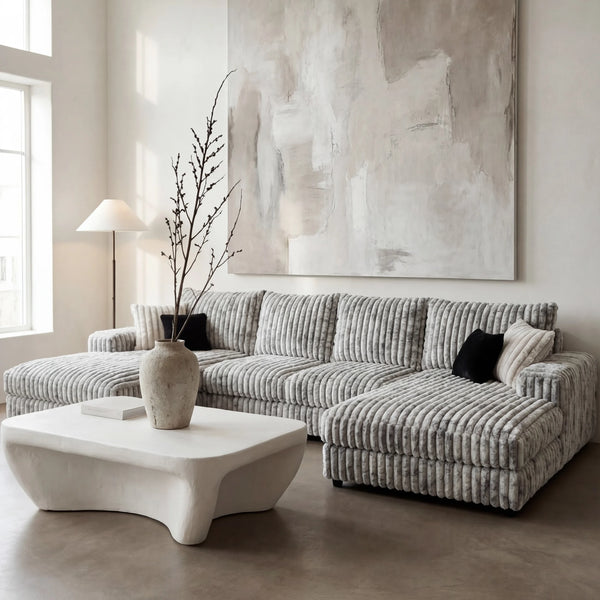 Big Wig Grey three-piece double chaise sectional staged in a styled living room