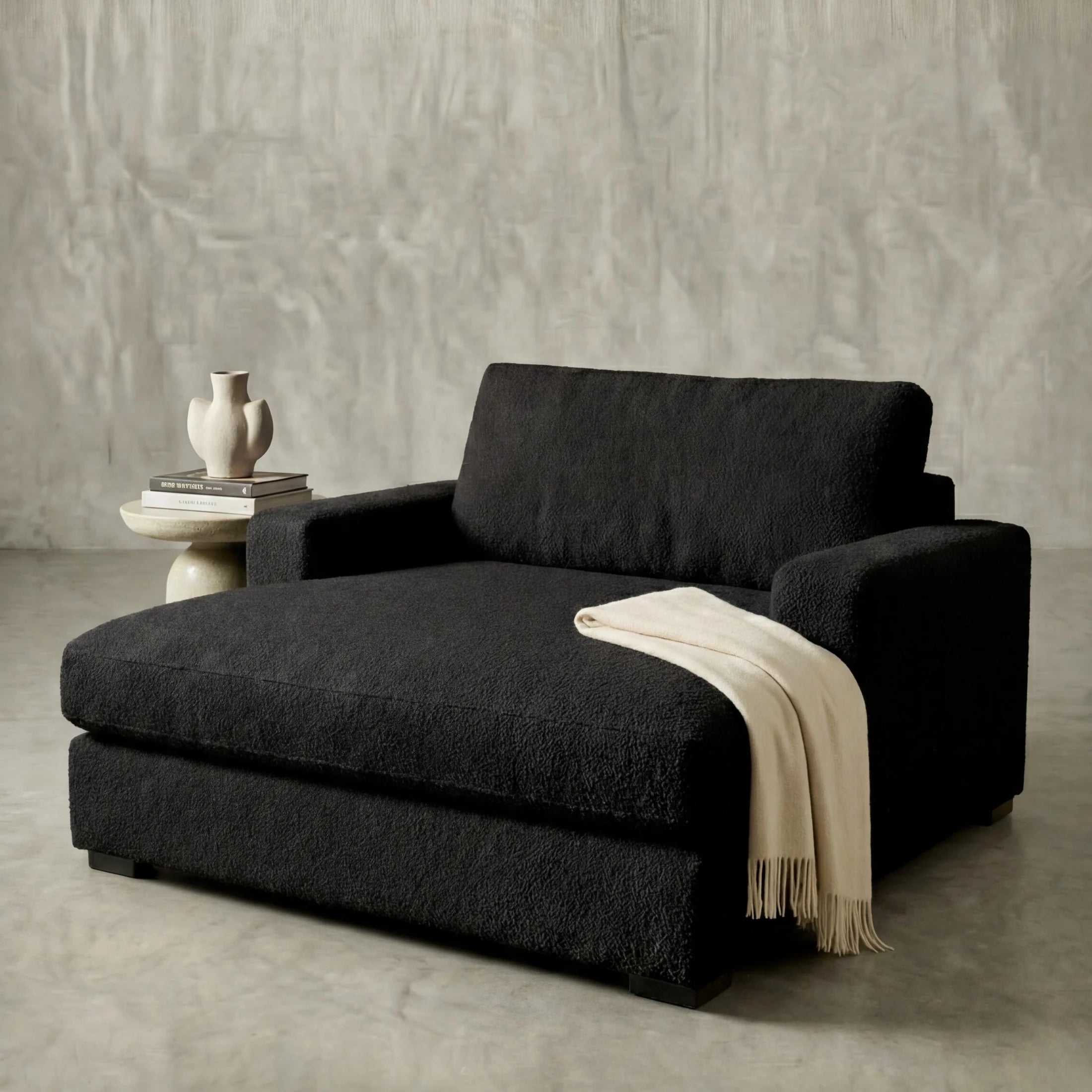 Cuddle Black chaise lounger staged in a styled living room (view 2)