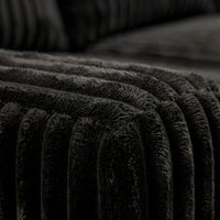 Detail view of Minky Black chaise lounger, showing fabric texture