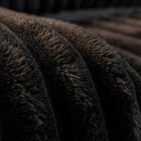 Detail view of Minky Black chaise lounger, showing fabric texture