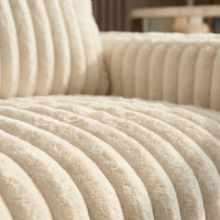 Detail view of Minky Cream chaise lounger, showing fabric texture