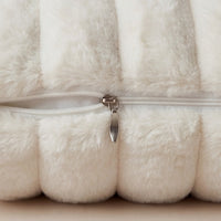 Close-up of removable cushion cover zipper on Minky Cream chaise lounger