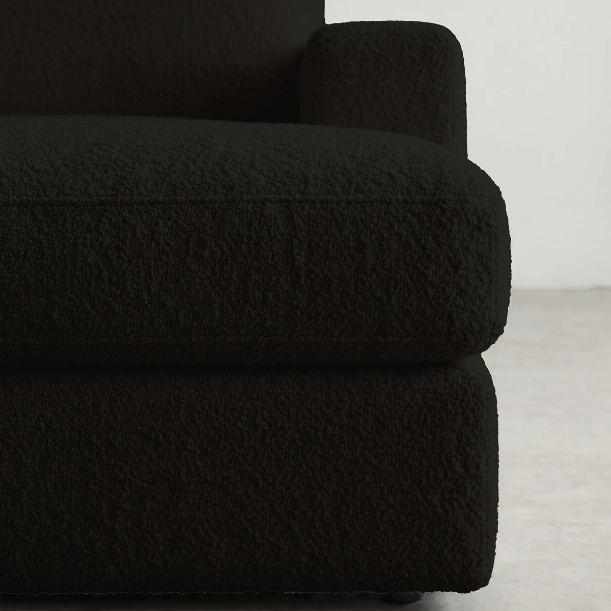 Close-up of cuddle black fabric texture, showing weave detail
