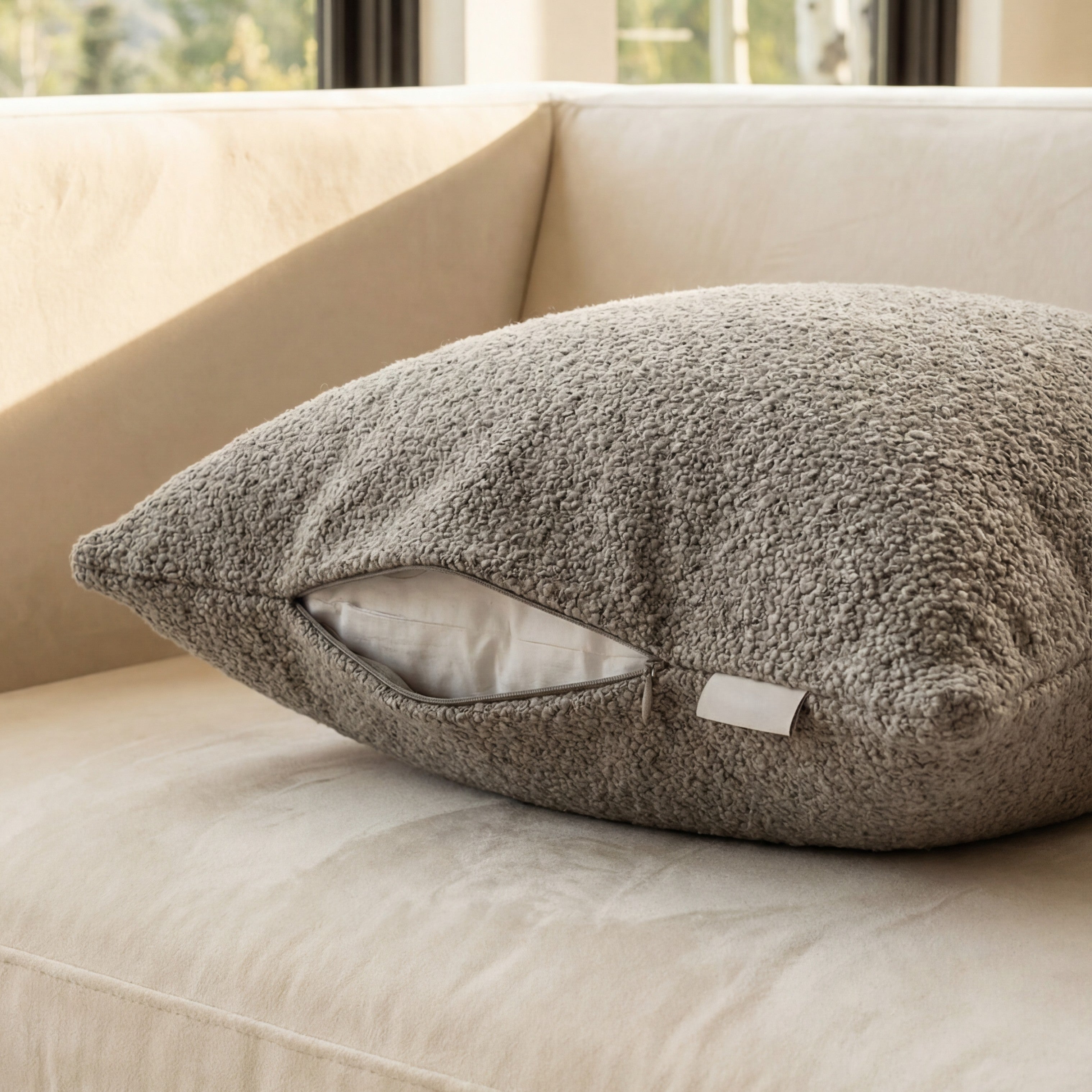 Cuddle Pewter chaise lounger styled with matching throw pillow