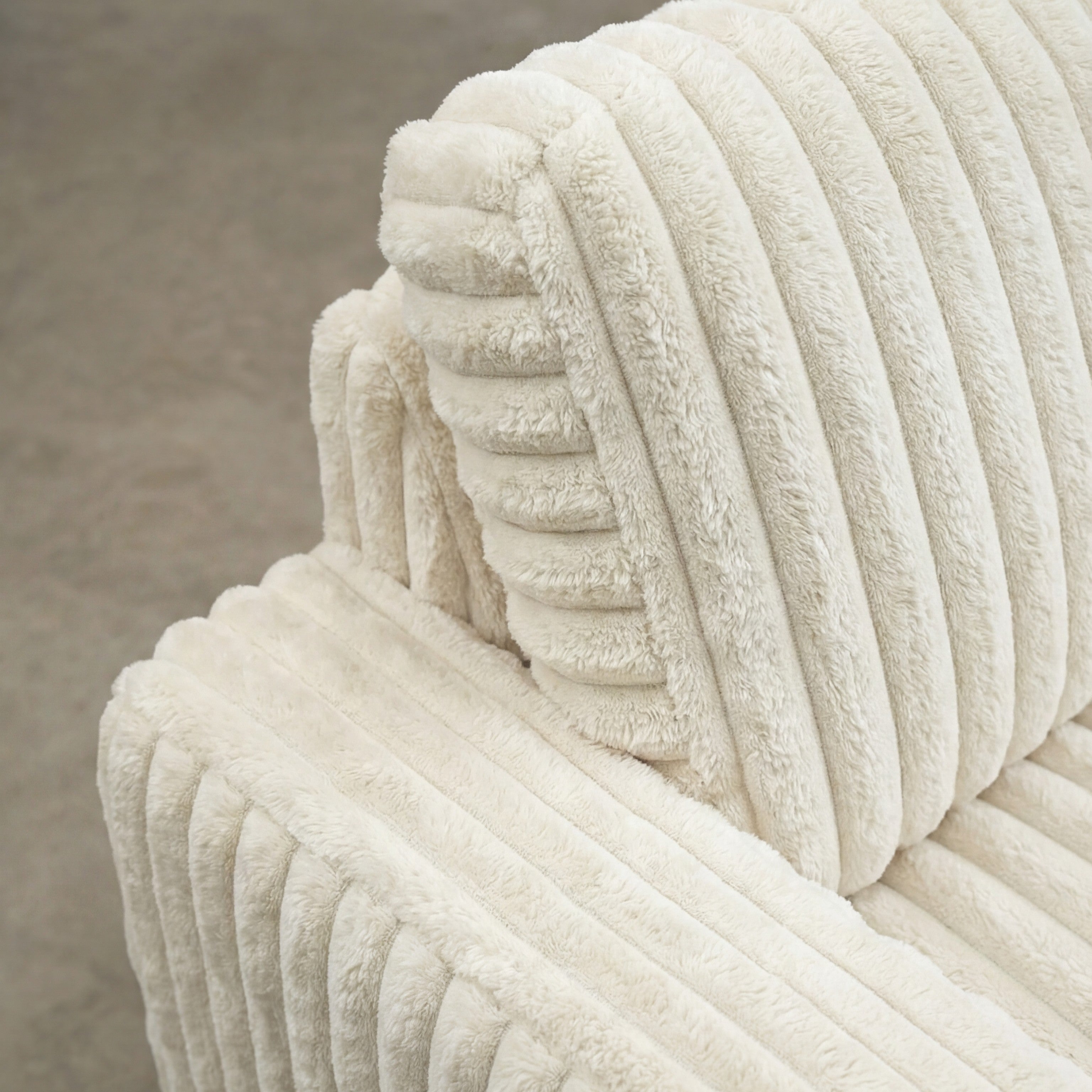 Detail view of Minky White chaise lounger, showing fabric texture