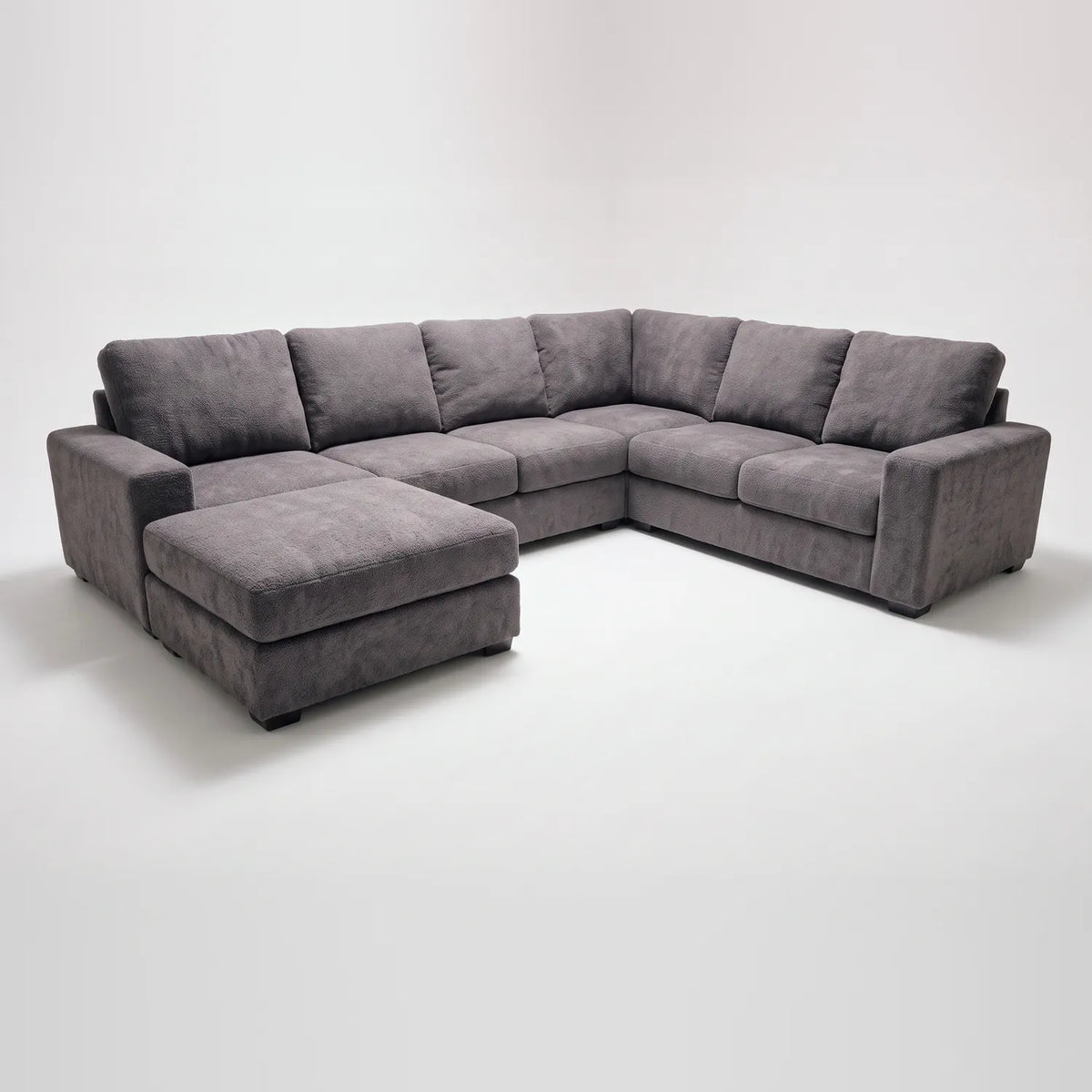 Seven-Piece Chaise Sectional - Cuddle Charcoal Modular - studio photo on white (LHF arrangement)